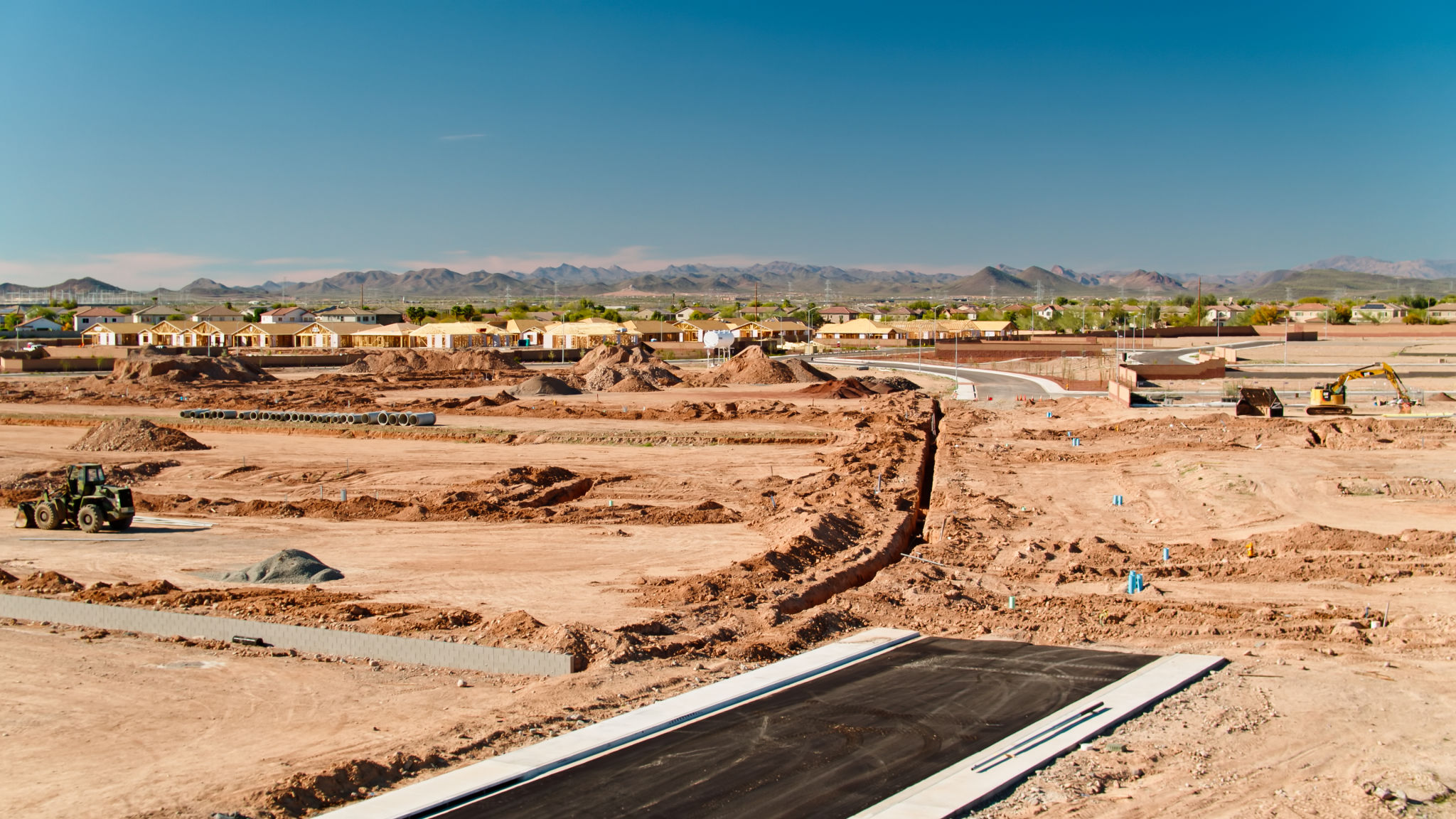 Low Drone Shot of Graded Land and Construction Frames in Peoria, AZ Low Drone Shot of Graded Land and Construction Frames in Peoria, AZ