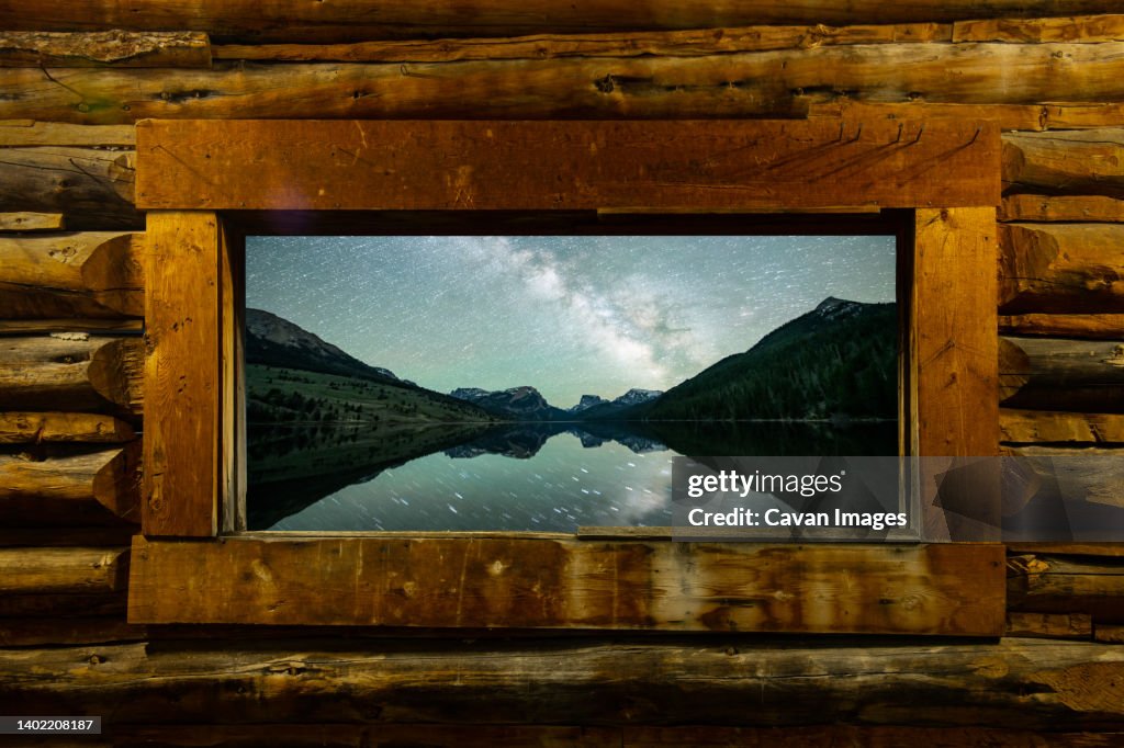 A log cabin and the beautiful mountains of the Wind River Range