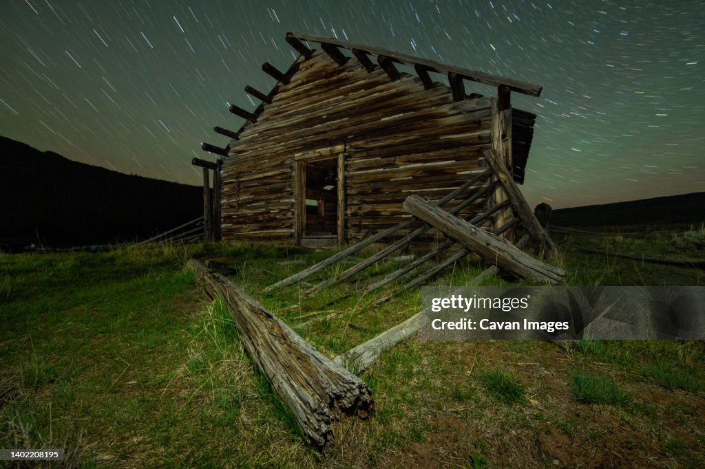 A log cabin and the beautiful mountains of the Wind River Range