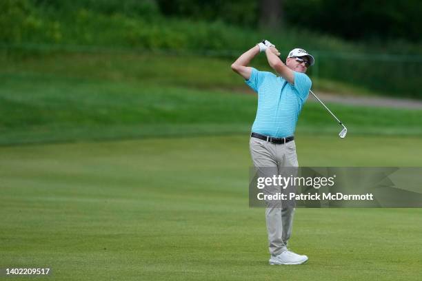 Steve Flesch of the United States hits a shot from the fairway on the 18th hole during the first round of the American Family Insurance Championship...