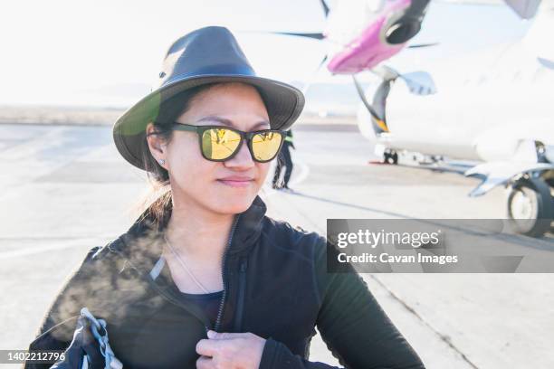 woman arriving by plane at small airfield in western mongolia - innere mongolei stock-fotos und bilder