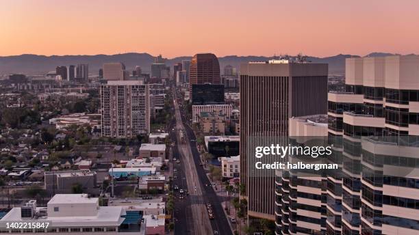 aerial shot of central avenue in midtown phoenix at sunrise - downtown phoenix stock pictures, royalty-free photos & images