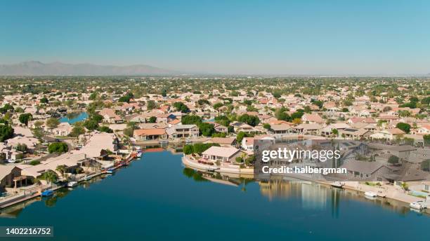 houses built around artificial lake in glendale, az - aerial - glendale arizona stock pictures, royalty-free photos & images