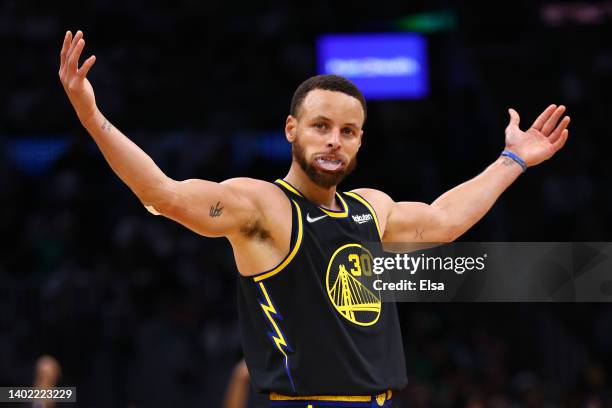 Stephen Curry of the Golden State Warriors celebrates a three point basket in the third quarter against the Boston Celtics during Game Four of the...