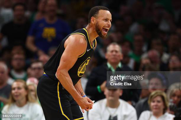 Stephen Curry of the Golden State Warriors celebrates a three point basket in the third quarter against the Boston Celtics during Game Four of the...