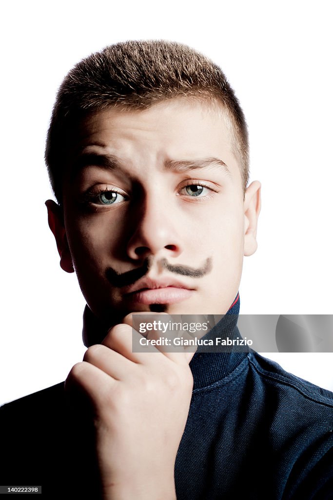 Teenager with painted moustaches