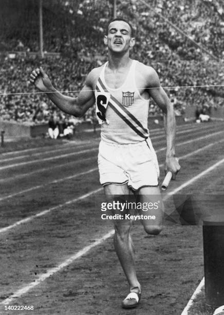 Mal Whitfield of the USA competing in the men's 4 × 400 metres relay at the London Olympics, Wembley Stadium, August 1948. The US team won the gold...