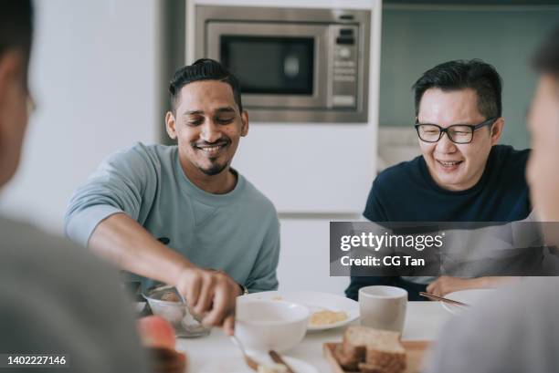 group asian male friends eating breakfast at apartment kitchen during weekend - amizade masculina imagens e fotografias de stock