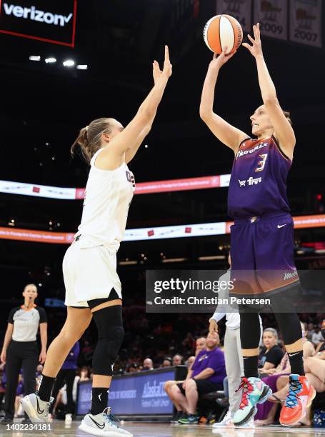 Diana Taurasi of the Phoenix Mercury puts up a three-point shot over Kristy Wallace of the Atlanta Dream during the second half of the WNBA game at...