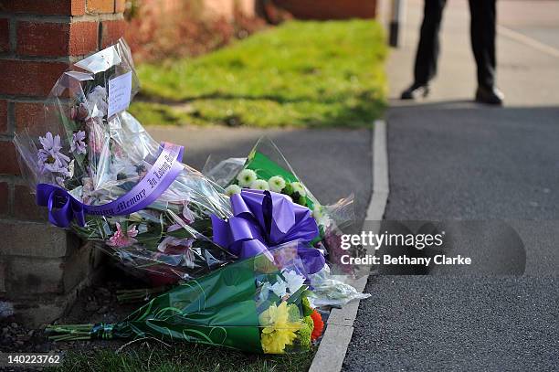 Floral tributes rest outside the home of PC David Rathband, following the discovery of his body on March 1, 2012 in Blyth, England. PC Rathband was...