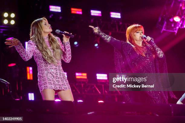 Carly Pearce and Wynonna Judd perform during day 2 of the CMA Fest 2022 at Nissan Stadium on June 10, 2022 in Nashville, Tennessee.