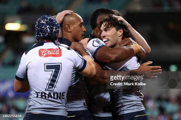 Grant Anderson of the Storm ccelebrates with his team mates after scoring a try during the round 14 NRL match between the Sydney Roosters and the...