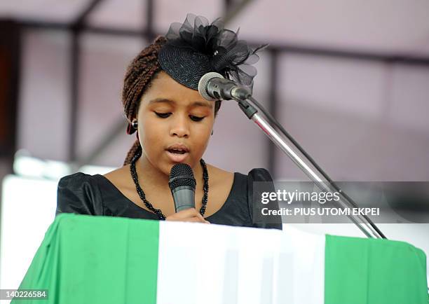 Nigeria's secessionist leader Odumegwu Ojukwu's 10-year-old daugther Chineme reads the Bible during the national inter-denominational funeral rites...