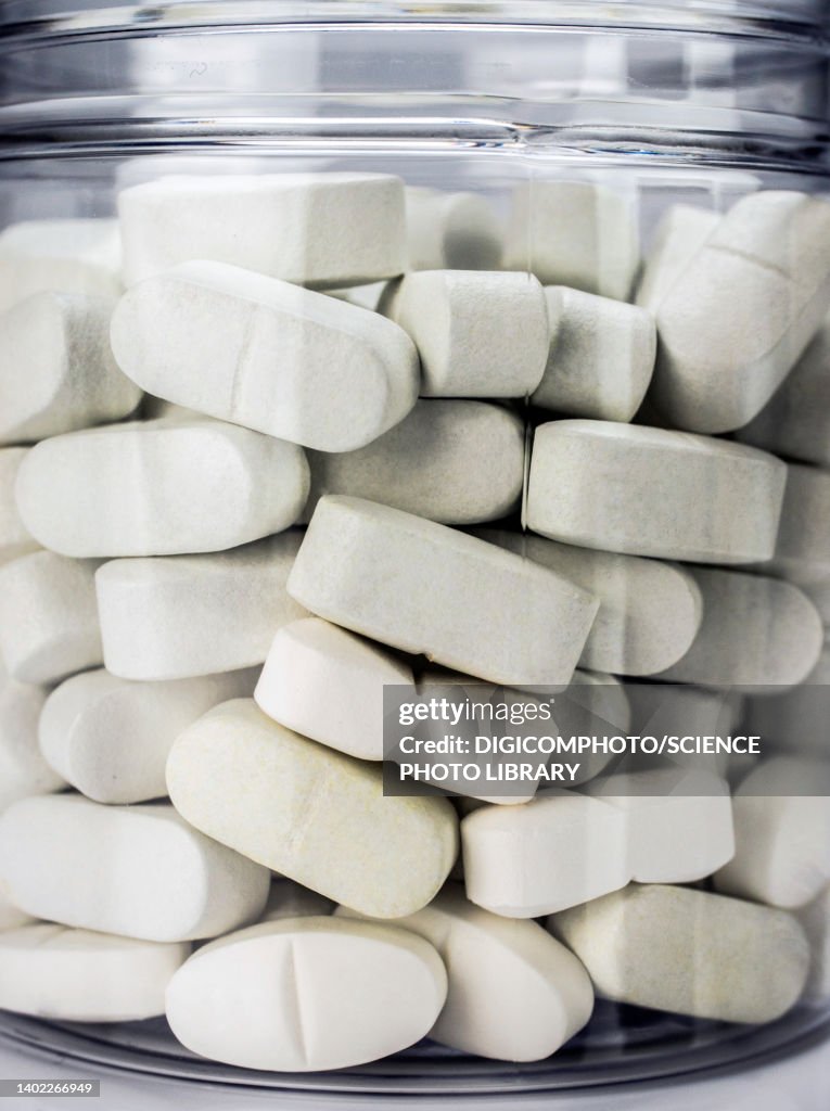 White pills inside a jar