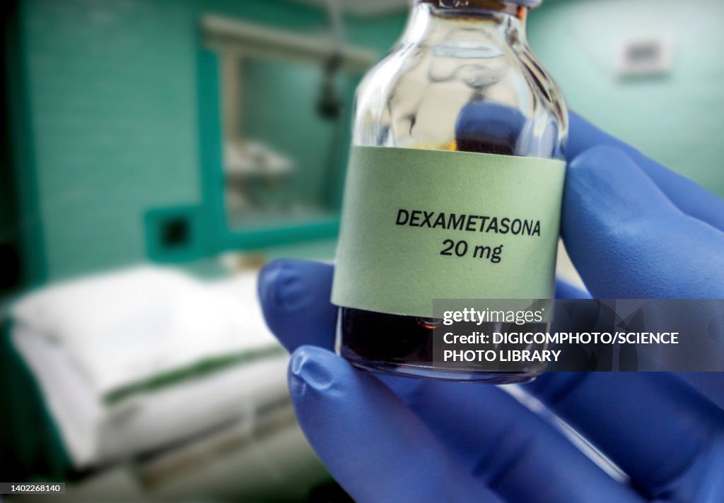 Doctor holding vial of dexamethasone in an operating theater