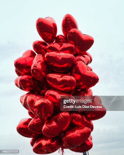 heart shaped balloons - helium balloon stock pictures, royalty-free photos & images