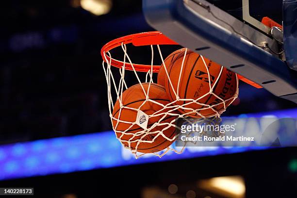 Detail of an official Spalding basketball going through the net with an offical logo of the 2012 Orlando NBA All-Star Game during the 2012 NBA...