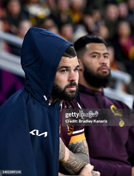 Adam Reynolds and Payne Haas of the Broncos are seen on the sideline after being injured during the round 14 NRL match between the Brisbane Broncos...