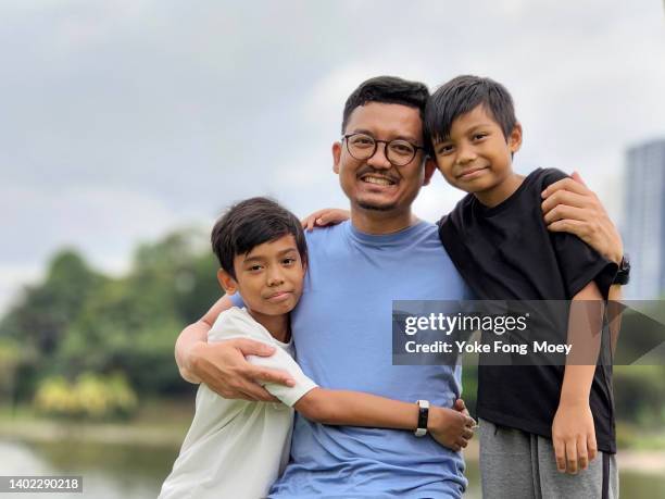 fatherhood - malayan ethnicity stock pictures, royalty-free photos & images