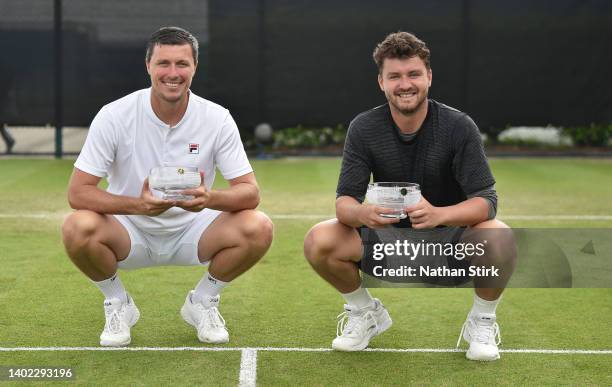 Ken Skupski and Jonny O'Mara of Great Britain pose with the Men's Doubles Trophy after beating Julian Cash and Henry Patten of Great Britain during...