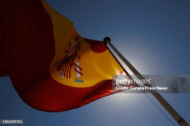 Flag of Spain flies at an exhibition of the Madrid Marine Infantry on the occasion of the Armed Forces Day, at the Puente del Rey esplanade in Madrid...