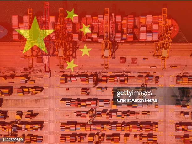 commercial port on the background of the chinese flag. cargo transportation in china - china economy stock pictures, royalty-free photos & images