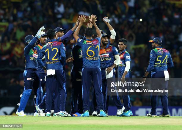 Sri Lankan players celebrate after taking the wicket David Warner of Australia during the 3rd match in the T20 International series between Sri Lanka...