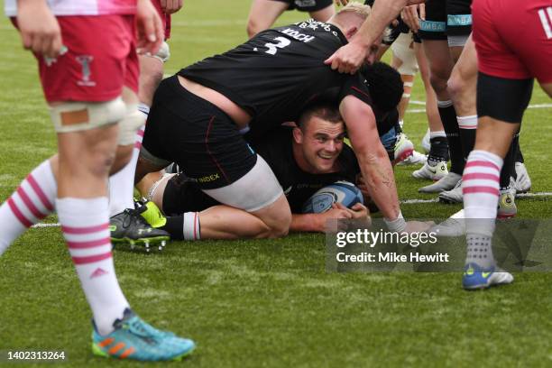 Ben Earl of Saracens goes over to score their side's fifth try and their hat-trick during the Gallagher Premiership Rugby Semi-Final match between...