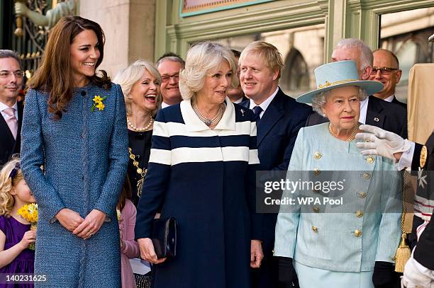 Catherine, Duchess of Cambridge and Camilla, Duchess of Cornwall watch as Queen Elizabeth II unveils a plaque commemorating the restoration of...