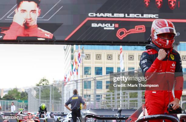 Pole position qualifier Charles Leclerc of Monaco and Ferrari celebrates in parc ferme during qualifying ahead of the F1 Grand Prix of Azerbaijan at...