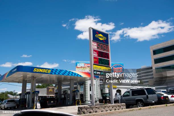 Prices displayed on a gas station on June 11, 2022 in Fort Lee, New Jersey. The costs of petrol, food and other necessities jumped in May, rising...