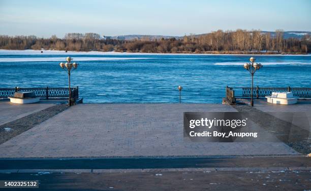 view of irkutsk waterfront with angara river in the morning. - irkutsk stockfoto's en -beelden