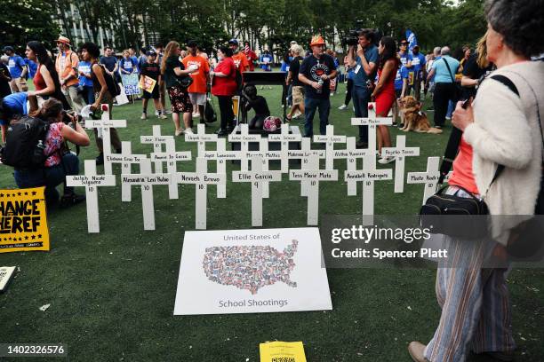 Memorial of white crosses is erected to the children killed at school in Uvalde, Texas at the starting point of the March for Our Lives protest on...