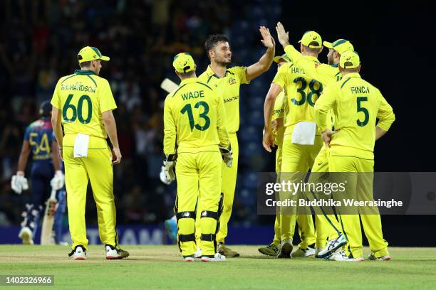 Marcus Stoinis of Australia celebrates with teammates after taking the wicket of Pathum Nissanka of Sri Lanka during the 3rd match in the T20...