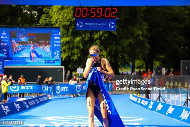 France's Cassandre Beaugrand gasps with emotion at taking victory in the women's race at the AJ Bell Leeds World Triathlon Championship Series race...