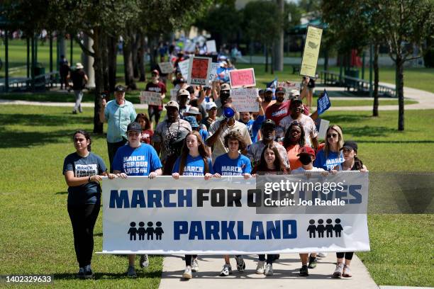 Protestors participate in the second March for Our Lives rally against gun violence at Pine Trails Park on June 11, 2022 in Parkland, Florida....