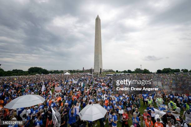 Demonstrators attend a March for Our Lives rally against gun violence at the base of the Washington Monument on the National Mall June 11, 2022 in...