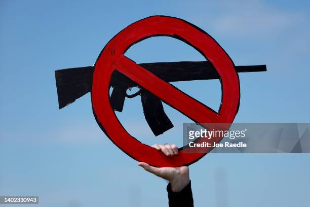 Ed Mackenzie holds a sign during the second March for Our Lives rally against gun violence at Pine Trails Park on June 11, 2022 in Parkland, Florida....