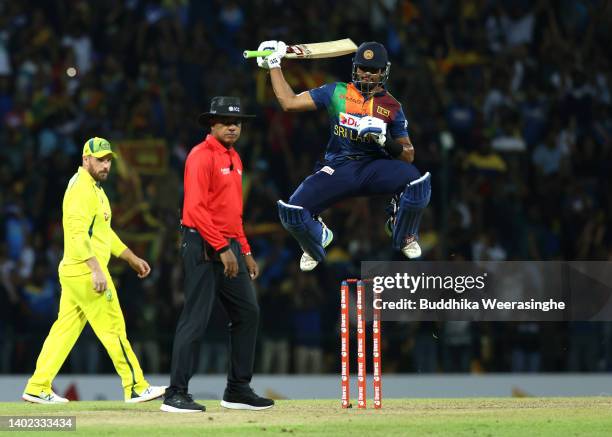 Dasun Shanaka of Sri Lanka celebrates hitting the winning runs to win the match during the 3rd match in the T20 International series between Sri...