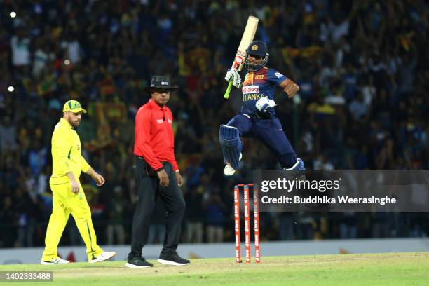 Dasun Shanaka of Sri Lanka celebrates hitting the winning runs to win the match during the 3rd match in the T20 International series between Sri...