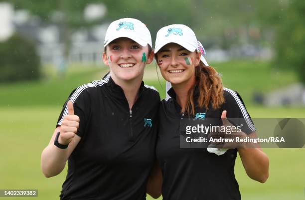Lauren Walsh and Caley McGinty of Team Great Britain and Ireland pose for a photograph after their victory on the 14th green during the Morning...
