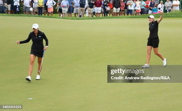 Annabell Fuller of Team Great Britain and Ireland reacts on the 16th green as her teammate Hannah Darling looks on during the Morning Fourballs on...