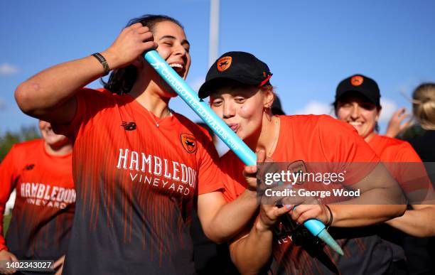Maia Bouchier and Carla Rudd of Southern Vipers celebrate with a stump following victory in the Charlotte Edwards Cup Final between Southern Vipers...