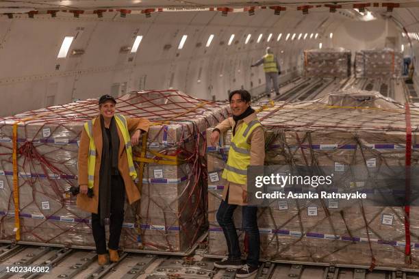 Kristy Carr, chief executive of Bubs Australia, poses with Dennis Lin in front of boxes of Bubs baby formula being loaded into a cargo plane at...
