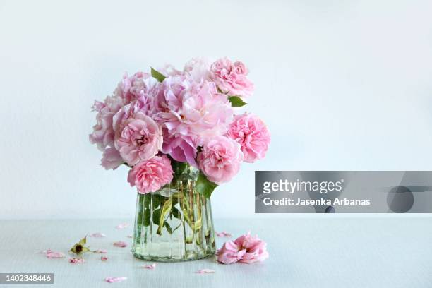 pink roses and peony  in vase - peonies bouquet stock pictures, royalty-free photos & images