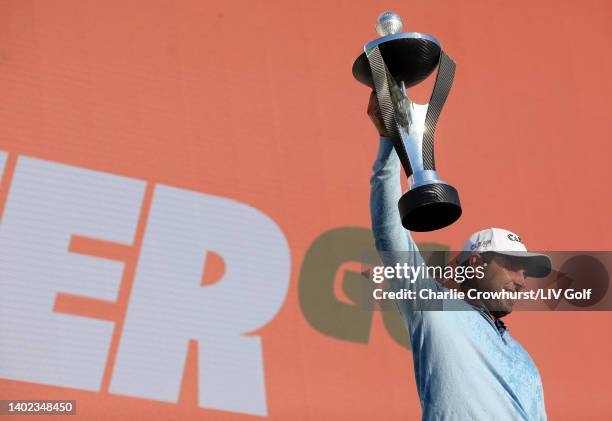 Charl Schwartzel of Stinger GC celebrates with the LIV Golf Invitational individual trophy following victory during day three of LIV Golf...