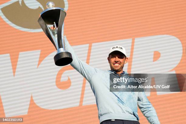 Charl Schwartzel of Stinger GC celebrates with the LIV Golf Invitational individual trophy following victory during day three of LIV Golf...