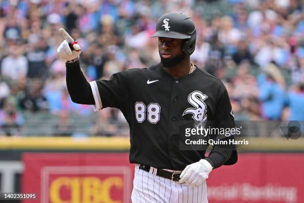 Luis Robert of the Chicago White Sox reacts on first base after his RBI single in the first inning against the Texas Rangers at Guaranteed Rate Field...