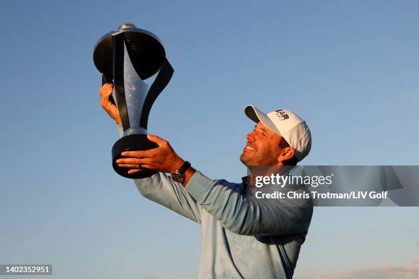 Charl Schwartzel of Stinger GC celebrates with the LIV Golf Invitational individual trophy following victory during day three of LIV Golf...