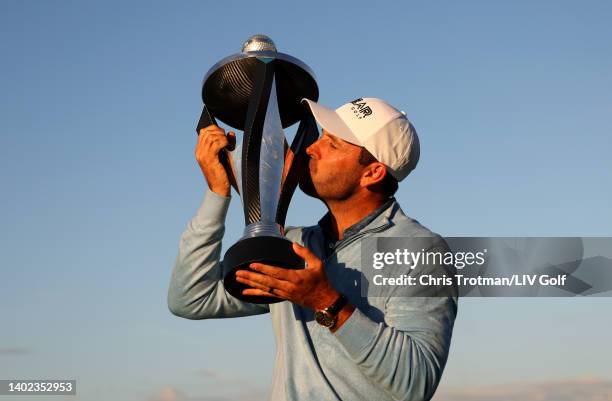 Charl Schwartzel of Stinger GC celebrates with the LIV Golf Invitational individual trophy following victory during day three of LIV Golf...